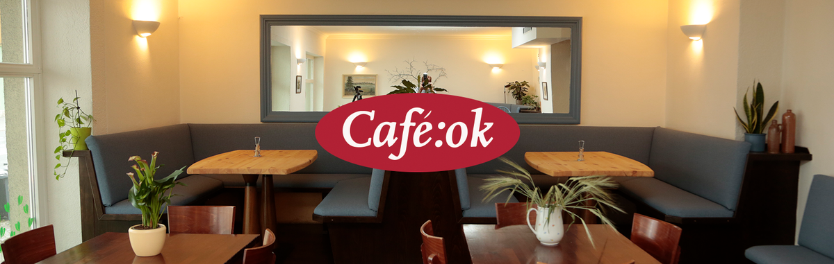 Cafe-ok dein Bio-Bistro, ein Teller mit Essen